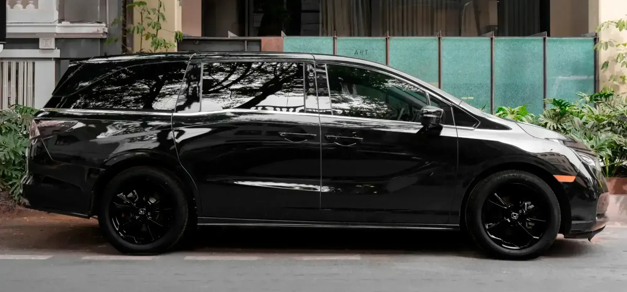 Black private transportation van parked outside Colima 71